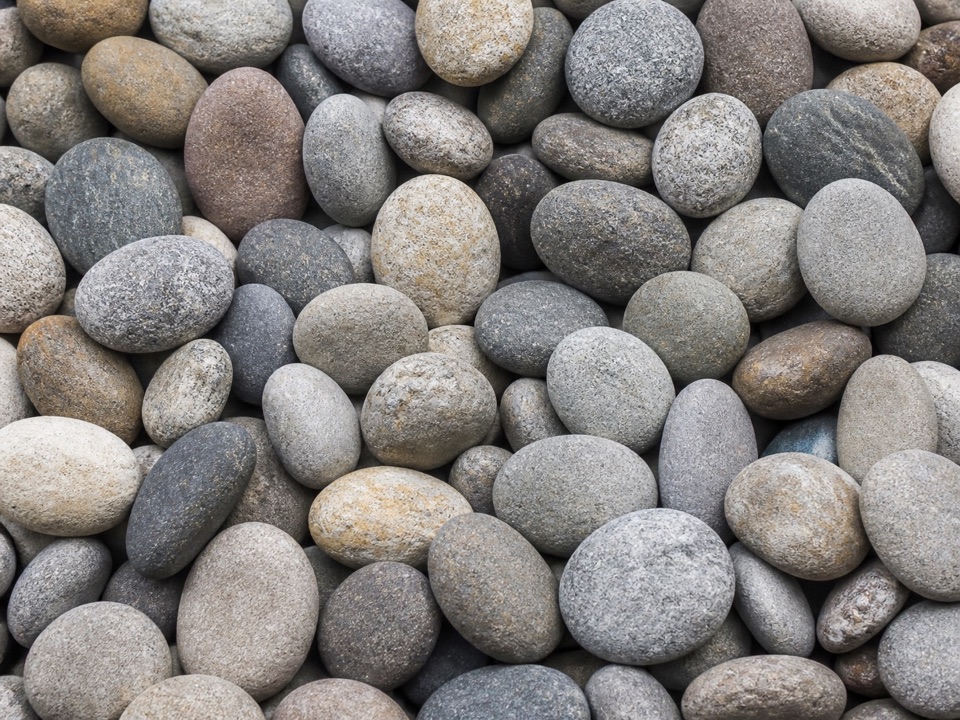 Close-up of smooth mixed gray river rock